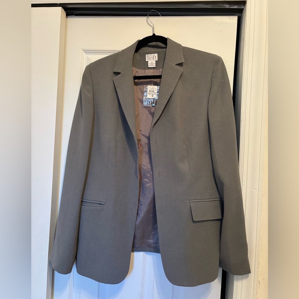 gray blazer in great condition with original tag still attached